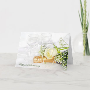 Cartão champanhe de aniversário e rosa