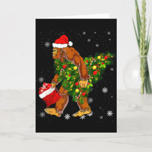 Cartão Crente do Pé-Grande Carregando Árvore de Natal Sas