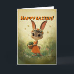 Cartão Cute Bunny in Orange Dress with Easter Basket<br><div class="desc">This charming Easter card features an adorable baby bunny in an orange dress, wearing a flower crown and carrying a basket of decorated eggs. Surrounded by soft meadow light and fluttering butterflies, the artwork captures warm springtime joy with a whimsical, storybook feel. Perfect for kids, families, and anyone who loves...</div>