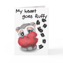 Cute Lemur hugs a big red love heart