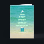 Cartão da árvore da palavra do Natal da praia<br><div class="desc">Uma foto da praia com a árvore bonita do mar & da estrela do mar e de Natal da palavra.</div>