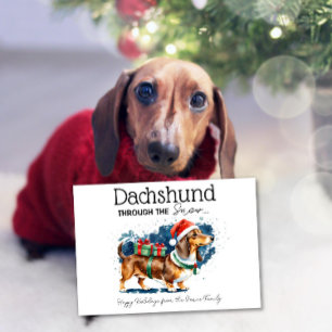 Cartão Dachshund Através da Neve