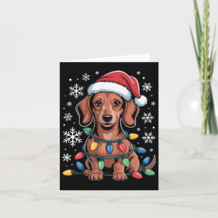 Cartão Dachshund Com Papai Noel Envolvido Na Luz De Natal