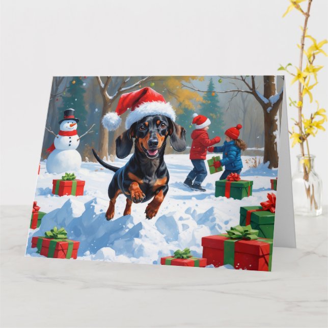 Cartão Dachshund Correndo na Neve com Chapéu de Natal (Flor Amarela)