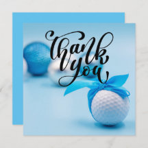 Bola de golfe com fita azul para chá de fraldas