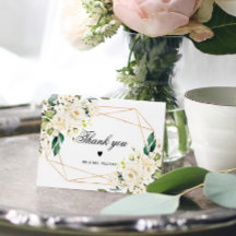 Flores brancas e quadro Dourado