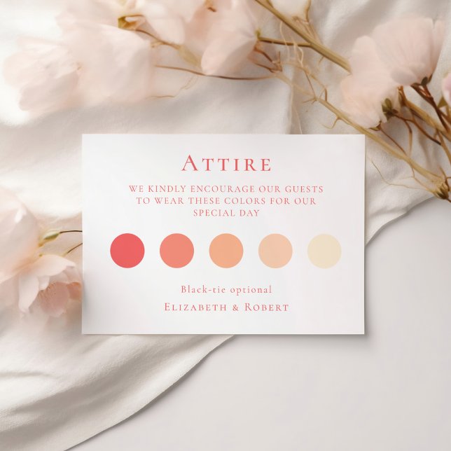 Cartão de Código de Vestido Convidado Coral Rosa (Coral Pink Wedding Attire Guest Dress Code Card on a white table with soft pink flowers.)