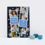 Cartão de Colagem de Fotos de Neve Photobooth Hanu<br><div class="desc">O cartão com fotos Chanucá bonito apresenta duas faixas de fotos, cada uma com três fotos e um painel de texto azul, para um total de seis fotos. Personalize com o ano e o seu nome ou nomes familiares em caracteres brancos, festivos e brancos, sobre um fundo azul marinho, pontilhado...</div>