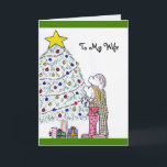 Cartão De Festividades As Pessoas da Lizzy Feliz Natal para a minha carta<br><div class="desc">Frente da mensagem: Dentro da mensagem "To My Wife": Ter você na minha vida faz meu Natal PERFEITO!Feliz Natal! Este cartão de Natal apresenta um desenho original, por mim, Elizabeth Avalos, de um jovem marido e mulher vestido de pijama e chinelos. Eles estão em frente a uma árvore de Natal...</div>