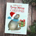 Cartão De Festividades Beary Felry Christmas Cute Bear Santa Hat<br><div class="desc">Um cartão de feriado do amigo da floresta, bonito e divertido, apresenta um fundo de lavagem a cor azul-d'água com um urso empacotado num cachecol e com o chapéu do Papai Noel preparando-se para abrir um presente de Natal. O lado inverso é o inverno azul da meia-noite com padrão branco...</div>