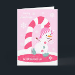 Cartão De Festividades Boneco de neve do patinagem no gelo do Natal do<br><div class="desc">Envie a um goddaughter especial um divertimento e um cartão de Natal cor-de-rosa festivo que caracterizam um boneco de neve feliz do patinagem no gelo com um bastão de doces colorido e os flocos de neve em uma luz - fundo cor-de-rosa. Cortesia do boneco de neve de Grafik bonito.</div>