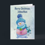 Cartão De Festividades Bonito bonitão segurando sinos de Natal, Snowy<br><div class="desc">Este cartão personalizável tem um bonitinho bonitinho bonitinho de boneca de neve em um lenço e boné. Está segurando sinos de Natal em fitas. Em um fundo de gradiente azul de neve. Dentro é uma imagem maior dos sinos. As cores são na sua maioria azuis e pinks. Você pode alterar...</div>