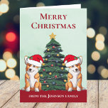 Cartão De Festividades Cão Personalizado da Árvore de Natal de Corgi Boni<br><div class="desc">Estes lindos cães Pembroke Welsh Corgi têm a cabeça inclinada dentro de um bonitinho chapéu de Papai Noel. Os dois filhotes estão sentados em frente a uma bonito árvore de Natal decorada com ornamentos coloridos. Um belo cartão de férias de corgis com um maravilhoso desenho de um duo de corgi...</div>