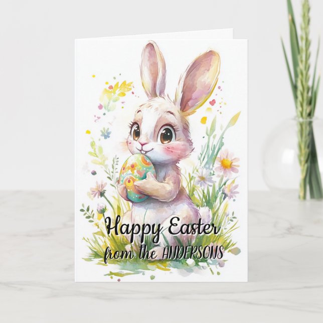 Cartão De Festividades Coelho fofo segurando ovo de Páscoa e floral (Frente)
