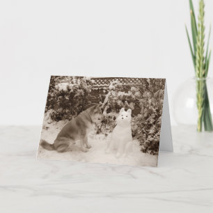 Cartão De Festividades cute akita sitting in snow with snowman dog photo