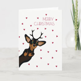 Cartão De Festividades Dachshund bonito com Feliz Natal dos antlers