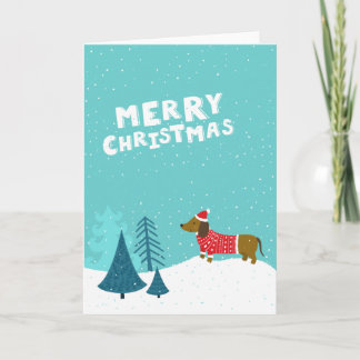 Cartão De Festividades Desenho bonito do Dachshund na paisagem do Natal