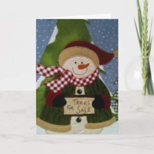 CARTÃO DE FESTIVIDADES É DENTRO QUENTE AO LADO DA ÁRVORE