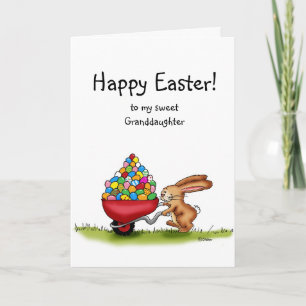 Cartão De Festividades Easter Bunny moves colored eggs in wheelbarrow