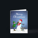 Cartão De Festividades Edifício Snowman<br><div class="desc">O menino construiu um boneco de neve que seu cachorro se sustenta e urina enquanto o menino dá ao boneco de neve um nariz de cenoura.</div>