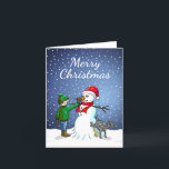 Cartão De Festividades Edifício Snowman<br><div class="desc">O menino construiu um boneco de neve que seu cachorro se sustenta e urina enquanto o menino dá ao boneco de neve um nariz de cenoura.</div>