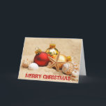 Cartão De Festividades Feliz Natal na praia<br><div class="desc">Um Sandy Beach com os enfeites de natal que descrevem um feriado morno do tempo. Aperfeiçoe para seu fuga ou lugar morno do tempo! Deseje a alguém o Feliz Natal através das milhas - totalmente customizáveis para que você personalize como você por favor!</div>