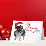 Cartão De Festividades Feliz Natal Tricolor Corgi Papais noeis Foto<br><div class="desc">Uma bela fotografia de férias para amantes de cachorros,  com um adorável pembroke welsh corgi vestindo um chapéu vermelho santa. Feliz Natal está escrito em vermelho ao lado da fotografia bonitinha.</div>