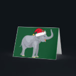 Cartão De Festividades Festa de Natal de Elefante Bonito em Santa Fé<br><div class="desc">Bons animais de férias são minha parte favorita do Natal. Um lindo elefante de cinza vestindo um chapéu vermelho de Papai Noel e parecendo feliz em um fundo verde festivo. Isto enche-me de espírito natalício.</div>