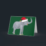 Cartão De Festividades Festa de Natal de Elefante Bonito em Santa Fé<br><div class="desc">Bons animais de férias são minha parte favorita do Natal. Um lindo elefante de cinza vestindo um chapéu vermelho de Papai Noel e parecendo feliz em um fundo verde festivo. Isto enche-me de espírito natalício.</div>