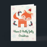 Cartão De Festividades Fox alaranjado no costume lunático do Natal do<br><div class="desc">Um encantamento personalizou o cartão de Natal com um dom retro. Uma ilustração de uma raposa alaranjada bonito, vestindo um chapéu vermelho do papai noel cercado por decorações do azevinho do Natal. Um animal pequeno doce da floresta. Ajuste em um fundo com os flocos de neve cor-de-rosa e azuis desvanecidos....</div>