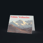 Cartão De Festividades Frohliche Weihnachten - Winter Eagle<br><div class="desc">Uma águia-careca voa perto da faixa de Chugach coberta pela neve perto de Anchorage,  AK. O texto alemão que lê "Frohliche Weihnachten" aparece a vermelho.</div>