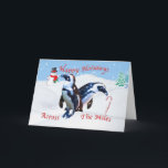 Cartão De Festividades Natal através das milhas, pinguins na neve<br><div class="desc">Dois pinguins estão olhando com perplexidade em um bastão de doces que cola fora da neve quando um boneco de neve de sorriso olhar sobre na distância. Os flocos de neve estão caindo toda ao redor. Esta é uma cena encantador do feriado para os jovens no coração. Faz um feriado...</div>