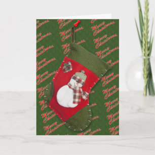 Cartão De Festividades Natal de Snowman estacionado por um costume verde