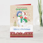 Cartão De Festividades Natal, neto. Cute Snowman e Puppy<br><div class="desc">Um doce cartão de Natal para um neto jovem. Ele apresenta uma adorável criança de neve abraçando um filhote de neve fofo. Ele está vestindo um chapéu azul, lenço verde e luvas vermelhas enquanto seu filhote está vestindo um chapéu de Papai Noel. A neve está caindo ao seu redor e...</div>