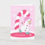 Cartão De Festividades Natal para Pequena Irmã Ice Skating Snowman<br><div class="desc">Envie a uma irmãzinha especial um cartão de Natal rosa,  divertido e festivo,  com um feliz boneco de neve patinando gelo com uma bengala colorida e flocos de neve em um fundo de rosa claro. Homem de neve cortesia do Bonito Grafik.</div>