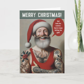 Cartão De Festividades Papai Noel Jovem e Sarado com Tatuagens