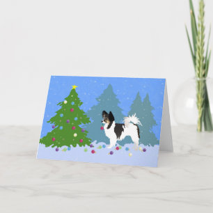 Cartão De Festividades Papillon Cão Decorando Árvore de Natal na Floresta
