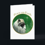 Cartão De Festividades Paz do Keeshond<br><div class="desc">Paz na terra. Mostre sua razão para a estação com seu Keeshond neste design original do cão acentuado com verde e ouro. Vai o excelente em um ornamento,  em um cartão ou em uma etiqueta.</div>