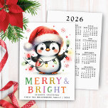 Cartão De Festividades Pinguin 2026 Calendar Feliz e Bright Christmas<br><div class="desc">Crie cartões de Natal personalizados e não-fotográficos com um pinguim giro, segurando luzes e vestindo um chapéu de Natal. O pinguim alegre e uma Feliz e saudações brilhantes estão do lado da frente. Na parte de trás, há um ano de cheio num relance de domingo a sábado de 2026. Use...</div>