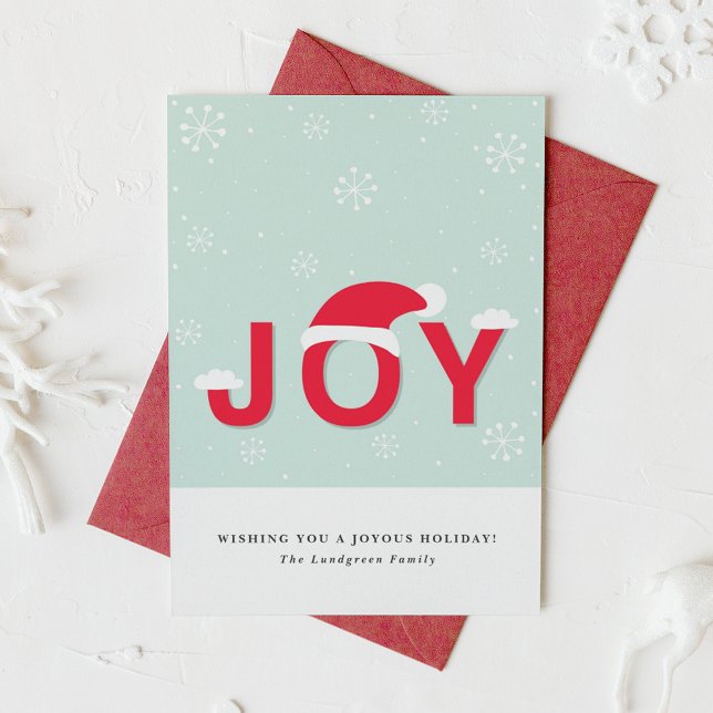 Cartão De Festividades Placa Plana de Feriado de Joy Snow (This holiday card design showcases the word “JOY” in lettering, playfully topped with a Santa hat.)