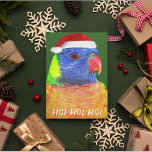 Cartão De Festividades Rainbow Lorikeet Vestindo Santa Hat Aussie<br><div class="desc">Um cartão de Natal divertido para seus amigos e família Aussie que mostra a foto de um papagaio colorido do Rainbow Lorikeet vestindo um chapéu vermelho de Papai Noel. Selecione entre um cartão de estilo mate ou brilhante.</div>
