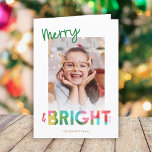 Cartão De Festividades Saudação Colorida de Foto de Natal e Bright<br><div class="desc">Este cartões de natal de Natal brilhante e divertido apresenta texto colorido, lendo, "Feliz e Brilho" em verde, limão, vermelho cereja, rosa, amarelo ouro e aqua. A tipografia para a palavra "Brilho" incorpora um design de papel tecidular sobreposto. Esta carta reluzente evoca uma sensação de brincadeira, riso e alegria infantil...</div>
