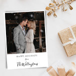 Cartão De Festividades Saudação de Natal com Script de Casal de Foto<br><div class="desc">Enviando seu primeiro cartão de feriado como casal casado? Esta bela design com tipografia de roteiro destaca seu novo nome de família junto com o espaço para duas fotos de casamento.</div>