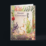 Cartão De Festividades Sereia e praia do Feliz Natal da vida marinha<br><div class="desc">Isto boas festas sob o cartão do mar caracteriza uma sereia bonita da aguarela e sua árvore de Natal da alga do feriado decoradas com ornamento, luzes e um cavalo marinho. ~ interno do cumprimento "que deseja lhe uma época natalícia morna e maravilhosa". O cumprimento pode ser personalizado para ler...</div>
