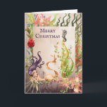 Cartão De Festividades Sereia e praia do Feliz Natal da vida marinha<br><div class="desc">Isto boas festas sob o cartão do mar caracteriza uma sereia bonita da aguarela e sua árvore de Natal da alga do feriado decoradas com ornamento, luzes e um cavalo marinho. ~ interno do cumprimento "que deseja lhe uma época natalícia morna e maravilhosa". O cumprimento pode ser personalizado para ler...</div>