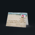Cartão De Festividades Snowman de Natal na praia<br><div class="desc">bonitinho bonitinho de neve na praia tropical com boas vindas de Natal na areia da praia</div>