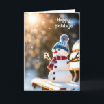 Cartão De Festividades Snowman de Natal num Bench Park<br><div class="desc">Bonito boneco de neve de Natal num banco de parque numa floresta de inverno com raios de sol</div>