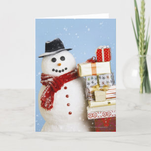 Cartão De Festividades Studio shot of snowman with Christmas presents