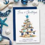 Cartão De Festividades Watercolor Tree Beach Seas and Greetings Blue<br><div class="desc">Modern Minimalist Elegance Calligraphy Ink Pen Handwritten Script Seas & Greetings Coastal Holiday Card includes a Watercolor Christmas Tree make of beach ocean driftwood,  seashells,  sand dollars,  nautical anchor ornament and topped with a starfish. Navy Blue Back.</div>