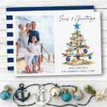 Cartão De Festividades Watercolor Tree Seas and Greetings Photo Striped<br><div class="desc">Modern Minimalist Elegance Calligraphy Ink Pen Handwritten Script Seas & Greetings Coastal Holiday Card includes a Watercolor Christmas Tree make of beach ocean driftwood,  seashells,  sand dollars,  nautical anchor ornament and topped with a starfish. Navy Blue and White Stripes Back. Photo Front.</div>
